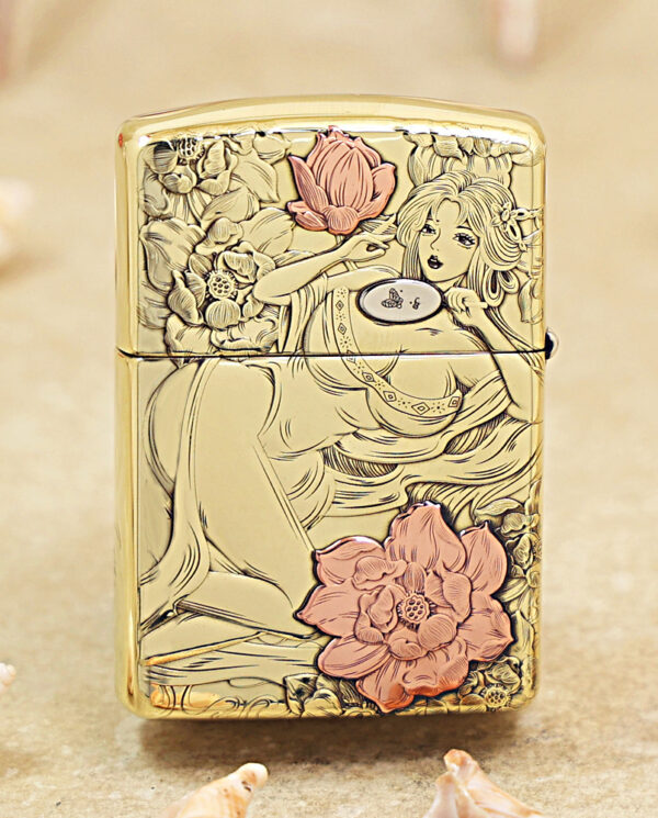 KZ456-01 Gold decorative lighter featuring line-art of a reclining woman among pink flowers, on a metallic surface.