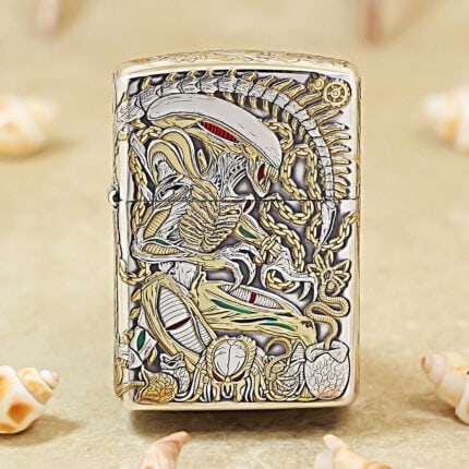 H.R. Giger Alien silver-tone Zippo Armor lighter with gold accents