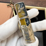 KZ476 engraved magical-academy artwork on the silver-tone Zippo lighter