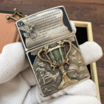 KZ476 silver-tone engraved Zippo lighter shown from the side