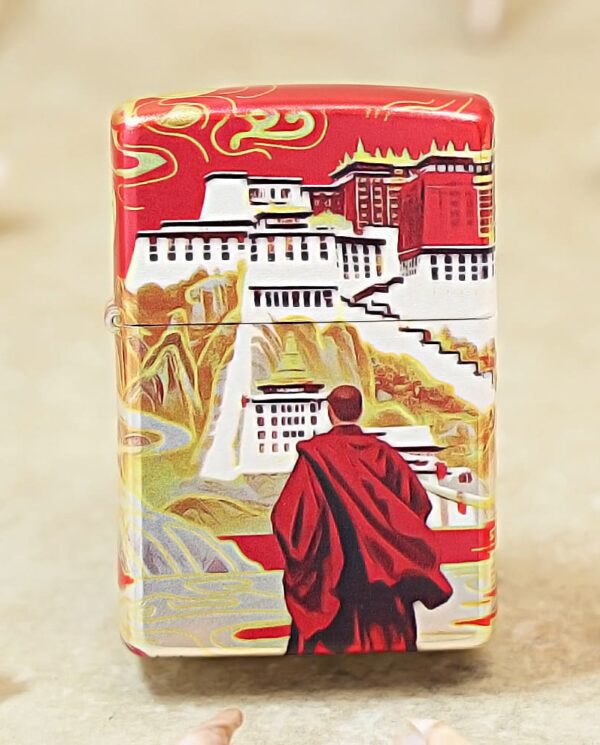 Decorative red-and-white box featuring a monk in a red robe overlooking a stylized temple scene.