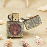 KZ498 open lighter showing copper St Benedict figure medallion