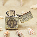 KZ499 open lighter showing brass St Benedict figure medallion