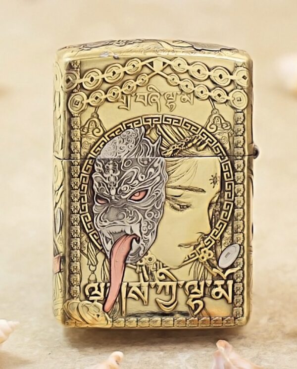 KZ501-01 Golden ornate lighter featuring a split design: a dragon/ mask on one side and a serene woman’s profile, framed by circular patterns and script.