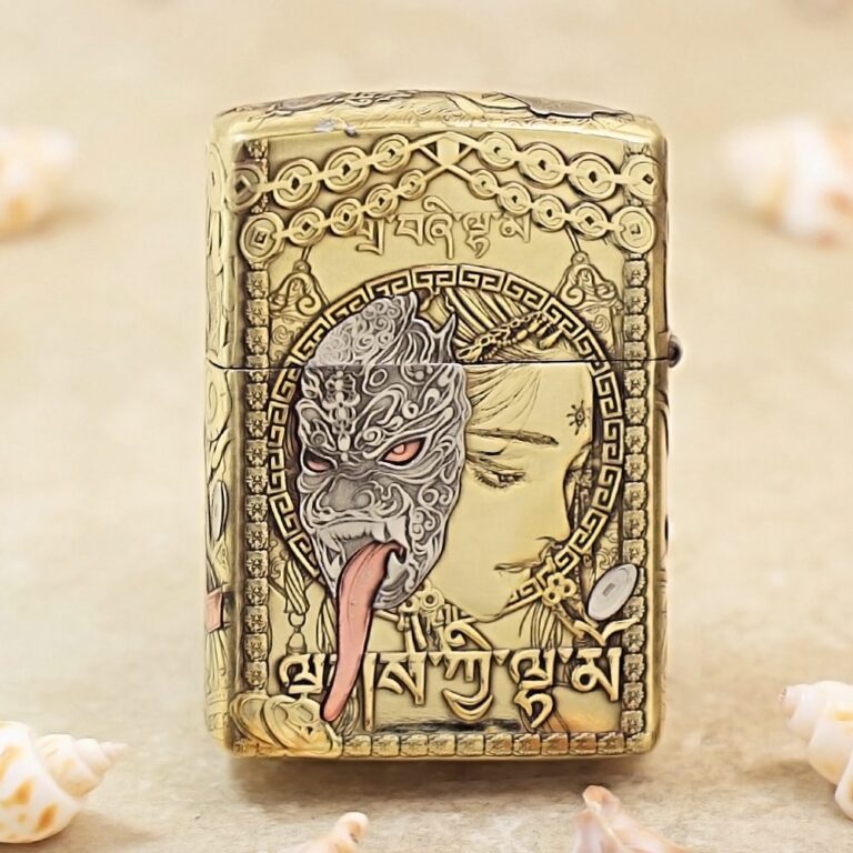 Golden ornate lighter featuring a split design: a dragon/ mask on one side and a serene woman’s profile, framed by circular patterns and script.