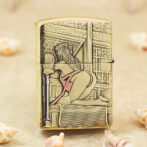 Decorative lighter with a vintage pin-up woman in lingerie posed against an ornate background