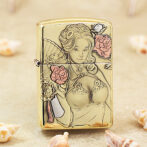 Gold Zippo lighter with an ornate line drawing of a woman surrounded by pink flowers and a fan motif,