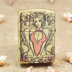 Gold decorative lighter featuring a stylized woman in a pink dress at a poker table with cards and chips.