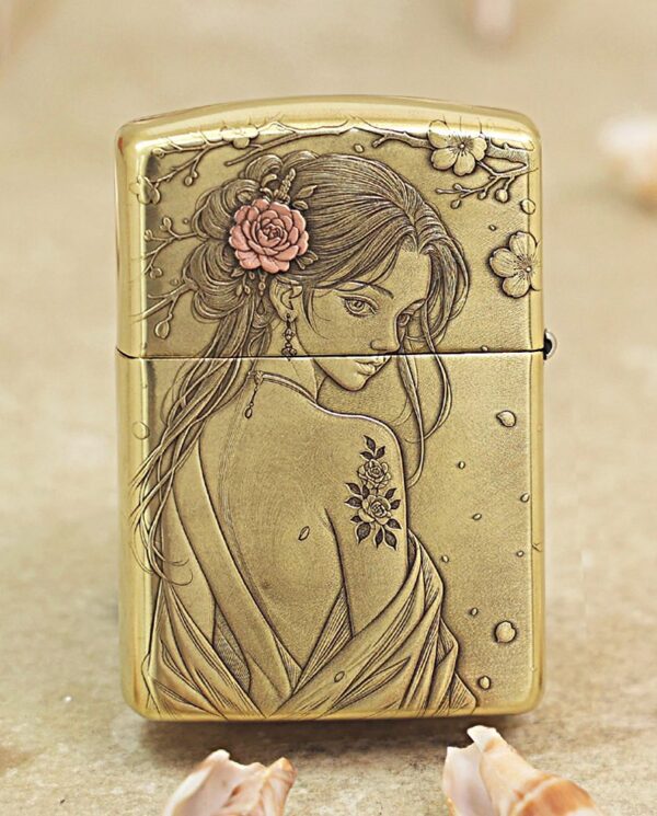 KZ509-01 Gold Zippo lighter engraved with a woman in a flowing dress and flowers in her hair.
