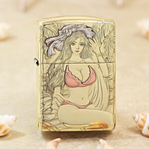 Gold-toned lighter with a pink bikini-clad illustrated woman among tropical leaves on the front surface.