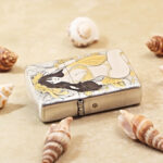 KZ370 silver-tone Beach Beauty lighter with gold and yellow artwork, reverse view