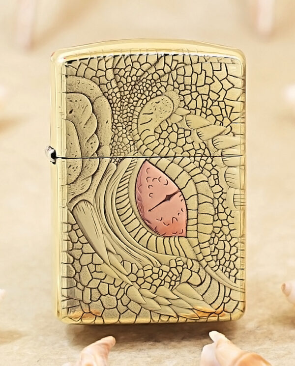 KZ371 Gold Zippo lighter with a cracked, lace-like engraving and a pink teardrop centerpiece.
