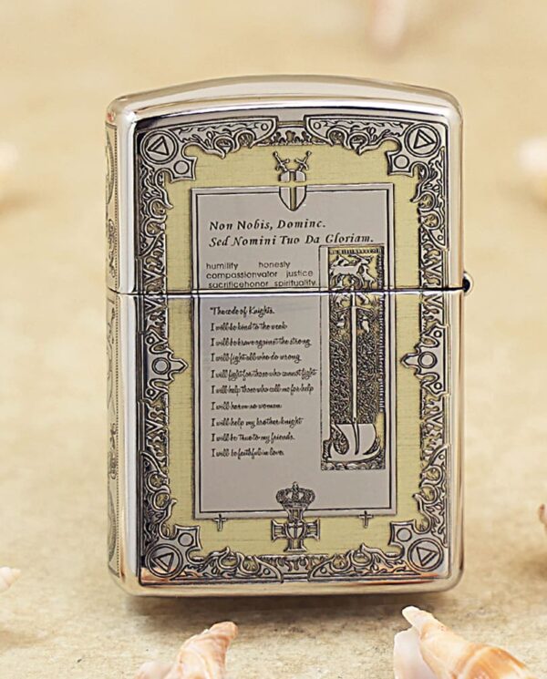 Ornate chrome Zippo-style lighter on a sandy beach with seashells nearby.