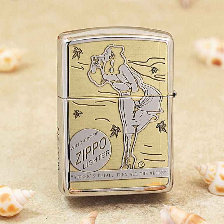 Shiny Zippo lighter with an engraved art of a woman in a dress, standing and leaning forward, on a sandy beach background.