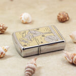 KZ134 chrome Zippo Armor lighter with gold-tone vintage artwork, side view