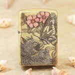 KZ135 brass Zippo Armor lighter with wolf, butterfly and pink floral engraving