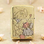 Gold Zippo lighter with an engraved cartoon scene showing a rabbit and a mouse among a toy tank and presents.