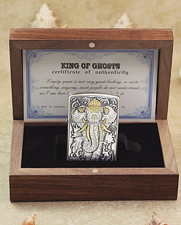 KZ127-06 Decorative metal lighter with an ornate elephant design in a wooden presentation box.