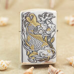 Metal Zippo-style lighter with an embossed koi fish and floral design in gold and silver tones.