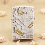 KZ148 Buddha Zippo Armor lighter with hammered texture and gold-tone leaf accents, reverse view