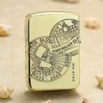 Close-up of a gold Zippo lighter with an engraved circular emblem reading 'American Classic' and years 1932–2008.