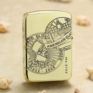 Close-up of a gold Zippo lighter with an engraved circular emblem reading 'American Classic' and years 1932–2008.
