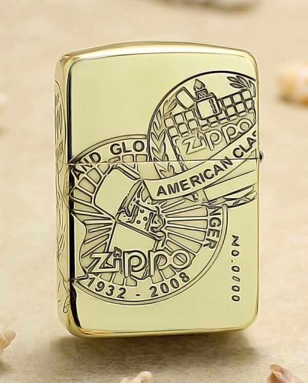 KZ161-01 Close-up of a gold Zippo lighter with an engraved circular emblem reading 'American Classic' and years 1932–2008.