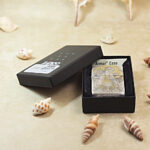 Open Mythological Figures Zippo Armor lighter presented beside the original box