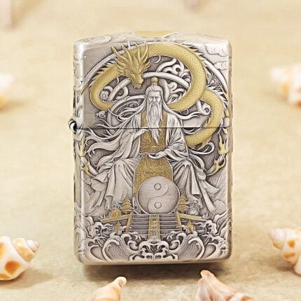 Silver-tone Zippo Armor lighter with engraved mythological figures and gold-tone accents