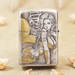 Close-up of the mermaid engraving and gold-tone accents on the Zippo Armor lighter