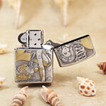 Open silver-tone Zippo Armor lighter showing the reverse ocean-themed engraving
