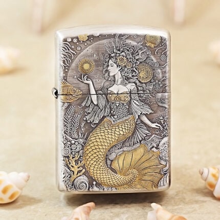 Silver-tone Mermaid Zippo Armor lighter with engraved ocean-inspired artwork