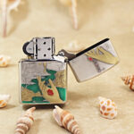Open silver-tone Zippo Armor lighter showing the reverse flower engraving