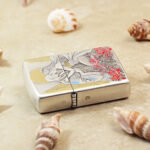 Angled view of the Red Spider Lily Zippo Armor lighter