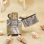 Open silver-tone Zippo Armor lighter showing the reverse motorbike-themed engraving