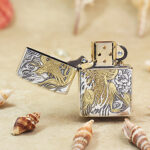 Open Phoenix Zippo Armor lighter showing the front gold-tone artwork