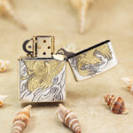 Open silver-tone Zippo Armor lighter showing the reverse cloud and floral engraving