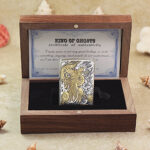 Open Phoenix Zippo Armor lighter presented beside the gift box