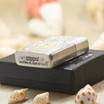 Golden Hairpin Beauty Zippo Armor lighter displayed with its black Zippo box