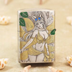 Close-up of the Beach Beauty figure and coastal engraving on the Zippo Armor lighter