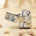 Open Beach Beauty Zippo Armor lighter showing the front artwork