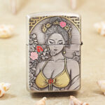 Close-up of the female portrait engraving and gold-tone accents on the Zippo Armor lighter