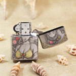 Open silver-tone Zippo Armor lighter showing the reverse decorative engraving