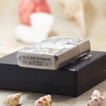 Scent of a Woman Zippo Armor lighter displayed with its black Zippo box