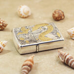 Angled view of the Geisha and Dragon Zippo Armor lighter with gold-tone details