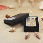 Open Geisha and Dragon Zippo Armor lighter presented beside the original box