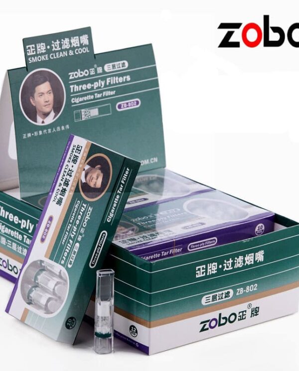 ZB802 Zobo three-ply cigarette filter boxes on a display, featuring teal packaging, a portrait, and the brand logo in the top right.
