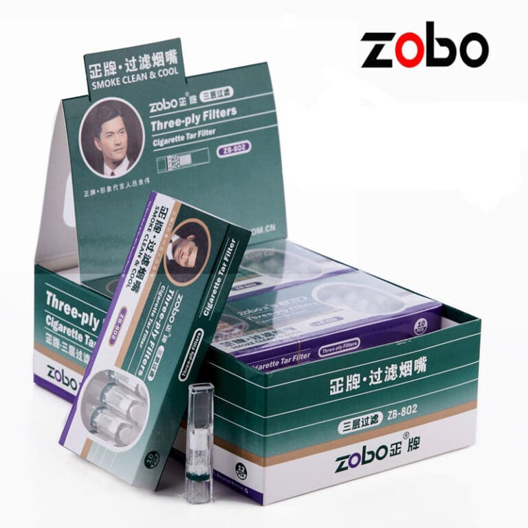 Zobo three-ply cigarette filter boxes on a display, featuring teal packaging, a portrait, and the brand logo in the top right.