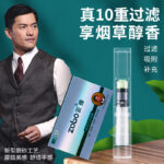Portrait of a man in a suit standing beside a tall transparent filtration device and a blue product box, with bold Chinese text promoting 10-layer filtration and tobacco aroma.