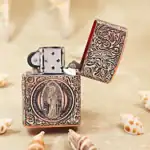 KZ331 open copper lighter showing St Benedict figure reverse